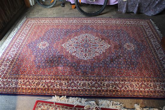 Red ground Persian design medallion carpet